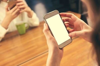 Midsection of woman using mobile phone