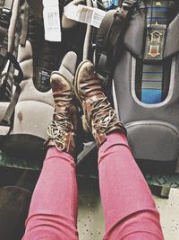 Low section of woman sitting on tiled floor