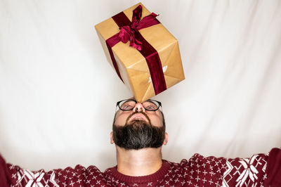 Portrait of man wearing hat at home