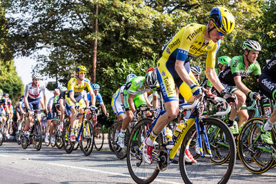 People riding bicycle on road