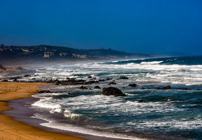 Scenic view of beach against sky