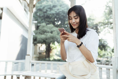 Young woman using mobile phone