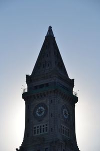 Low angle view of clock tower against clear blue sky