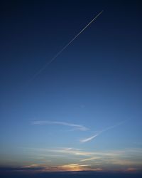 Scenic view of vapor trails in sky
