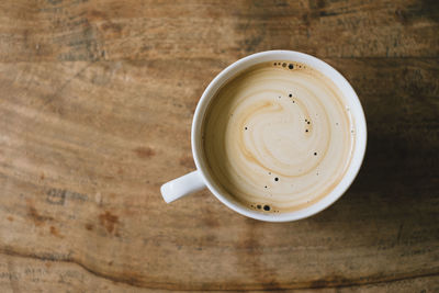 High angle view of coffee cup on table