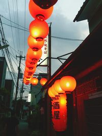 Illuminated lamp in city at night