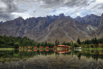 Scenic view of lake and mountains against sky