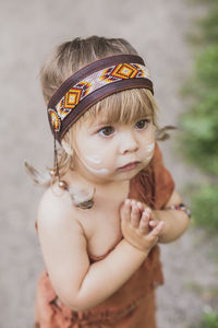 Cute baby dressed in traditional native american costume