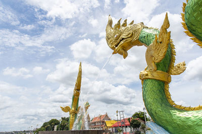 Low angle view of statue against sky