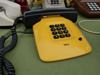 High angle view of telephone booth on table