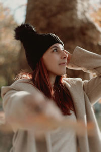 Portrait of young woman looking away