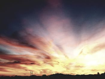 Scenic view of dramatic sky during sunset