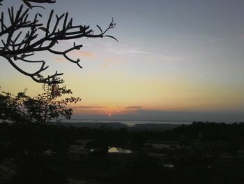 Scenic view of silhouette landscape against sky during sunset