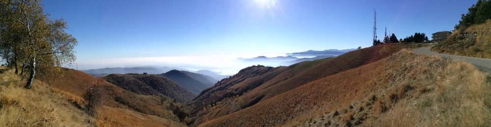 Panoramic shot of mountain against blue sky