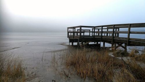 Scenic view of sea against sky during winter