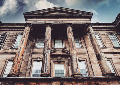 Low angle view of old building against sky