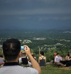 Man photographing through smart phone