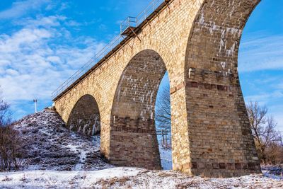 Viaduct in plebanivka village, terebovlyanskiy district of ukraine, on a sunny winter day