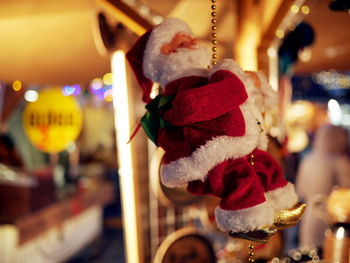Close-up of santa claus figurine hanging in store