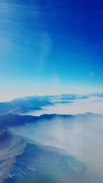 Scenic view of sea against blue sky