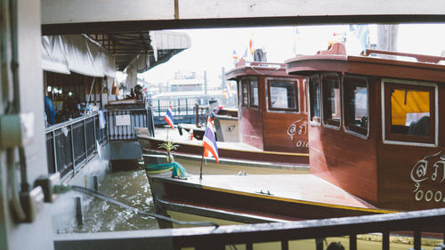 View of boats in canal along buildings