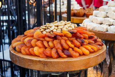 Whole dried apricots with nuts in a pottery