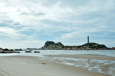 Scenic view of beach against sky