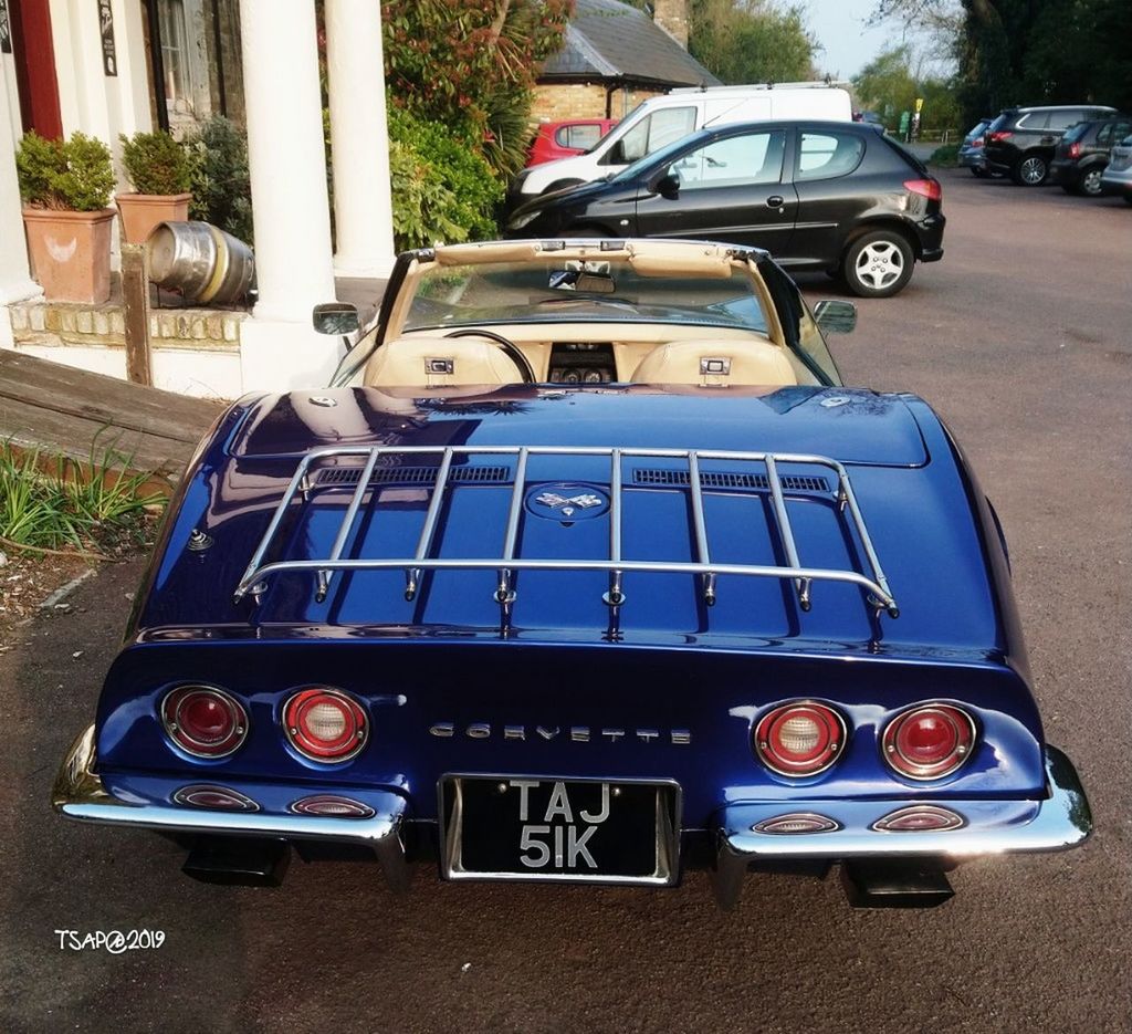 car, mode of transportation, motor vehicle, transportation, land vehicle, day, retro styled, no people, vintage car, stationary, city, outdoors, blue, vintage, headlight, plant, close-up, street, chrome