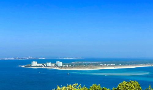 Scenic view of sea against blue sky