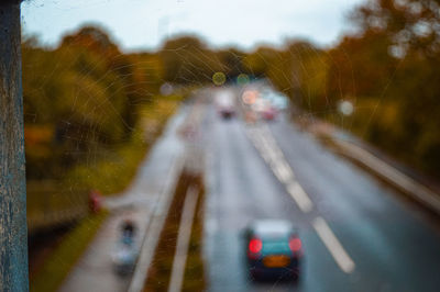 Blurred motion of car on road in city