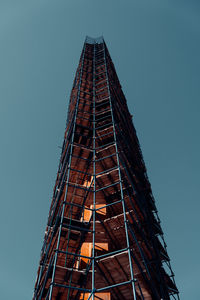 Low angle view of building against clear blue sky