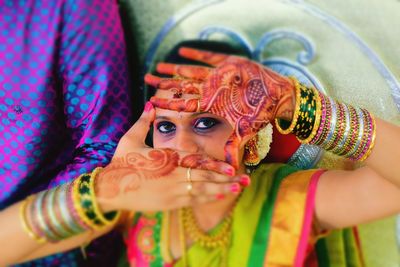 Close-up of young woman wearing mehndi