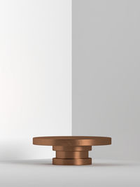 Close-up of stack of table against white background