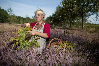 Portrait of young woman sitting on hay