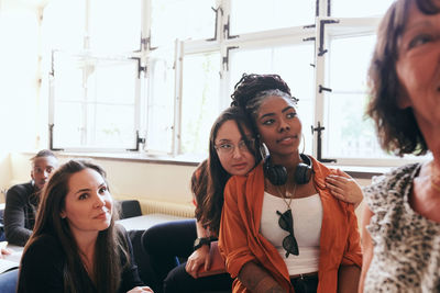 Female students concentrating in language classroom