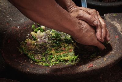 Close-up of man preparing food