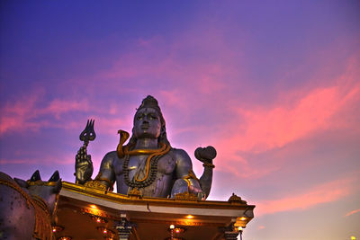 Statue of temple at sunset