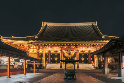 View of illuminated building against sky at night