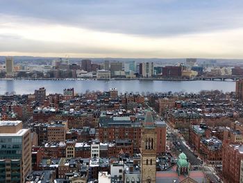 High angle view of city buildings against sky