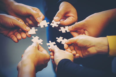 Close-up of people holding hands