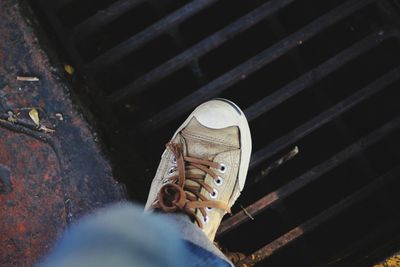 Low section of person on metal