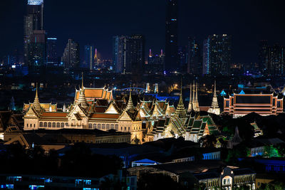 Illuminated buildings in city at night