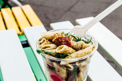 Close-up of pasta in disposable cup on table