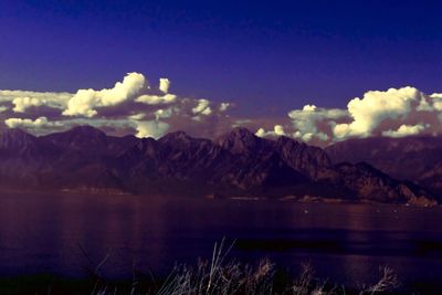 View of mountain range against cloudy sky