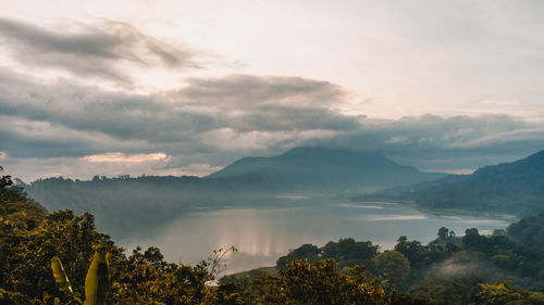 Scenic view of mountains against sky at sunset