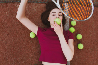 High angle portrait of woman holding ball