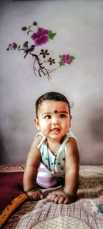 Portrait of cute girl smiling on bed