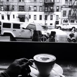 Close-up of man holding coffee cup