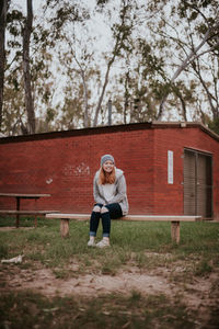 Portrait of woman with umbrella on street