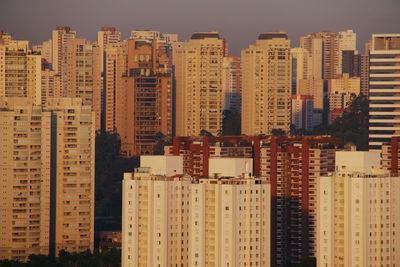 Buildings in city against sky